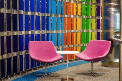 Pink Chairs white table with rainbow background panel design