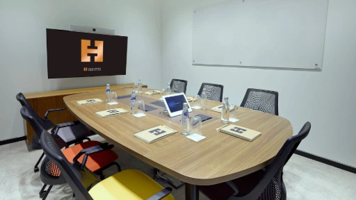 Herman Miller Sayl Chairs placed in a meeting room with table
