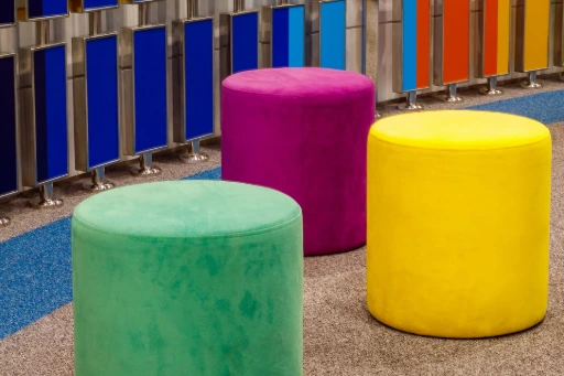 three ottomans with rainbow background panel design