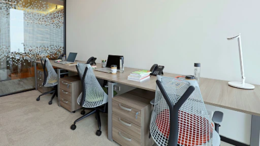Herman Miller Sayl Chairs placed close to each other on a work table