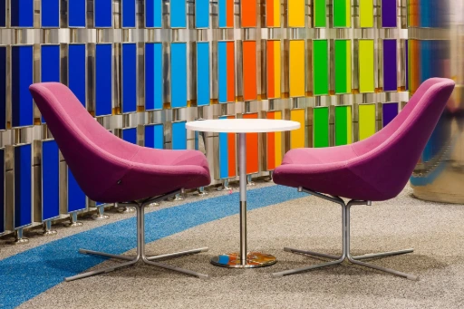 Pink Chairs white table with rainbow background panel design