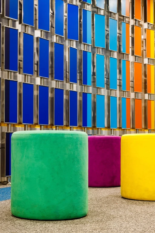 three ottomans with rainbow background panel design
