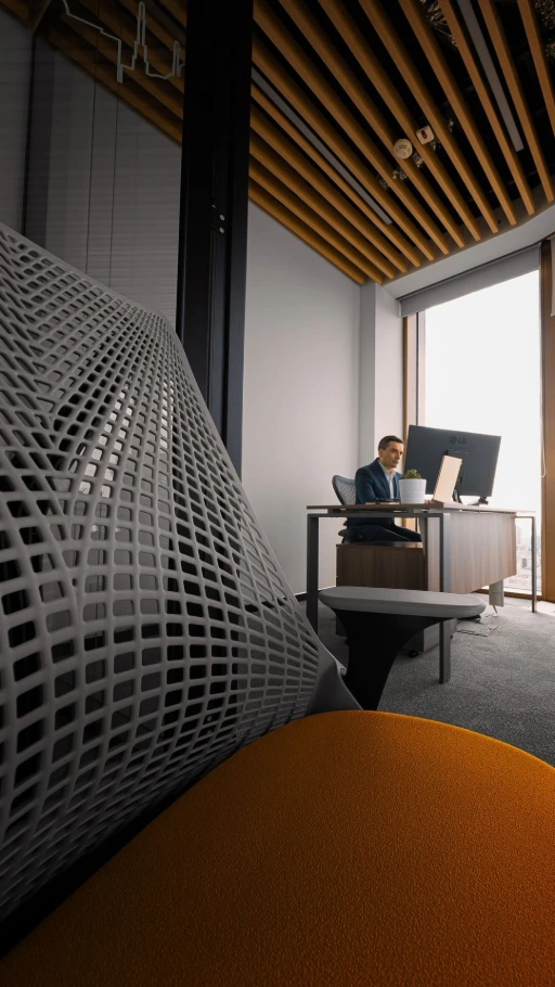Herman Miller Sayl Chair with yellow upholstered seat with a person working in the background