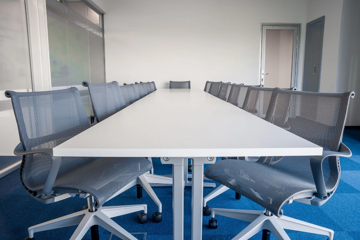 Herman Miller Setu Chairs with Long White Table