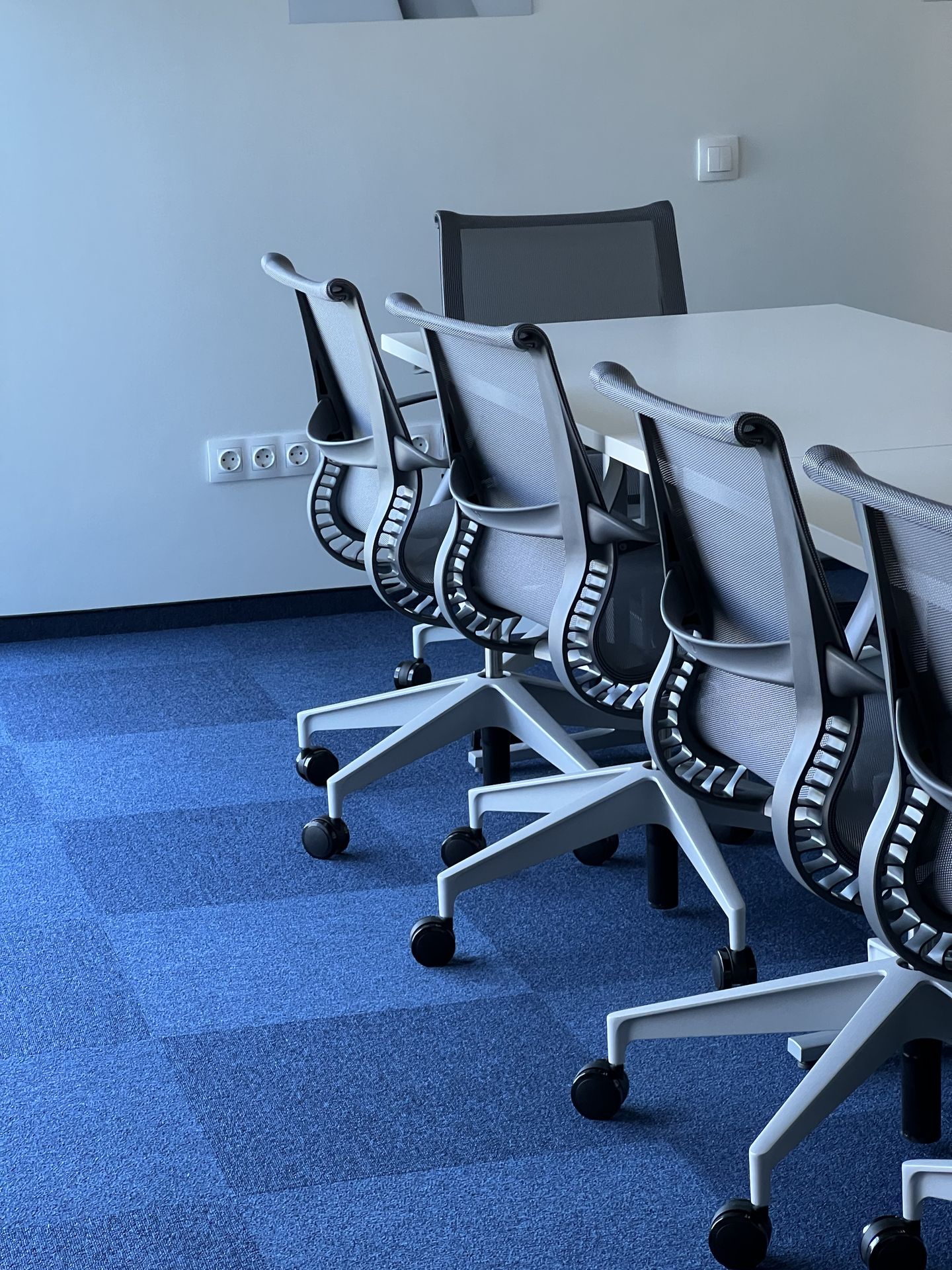 Herman Miller Mirra 2 and Setu chairs — open-plan workstations, finance HQ Almaty