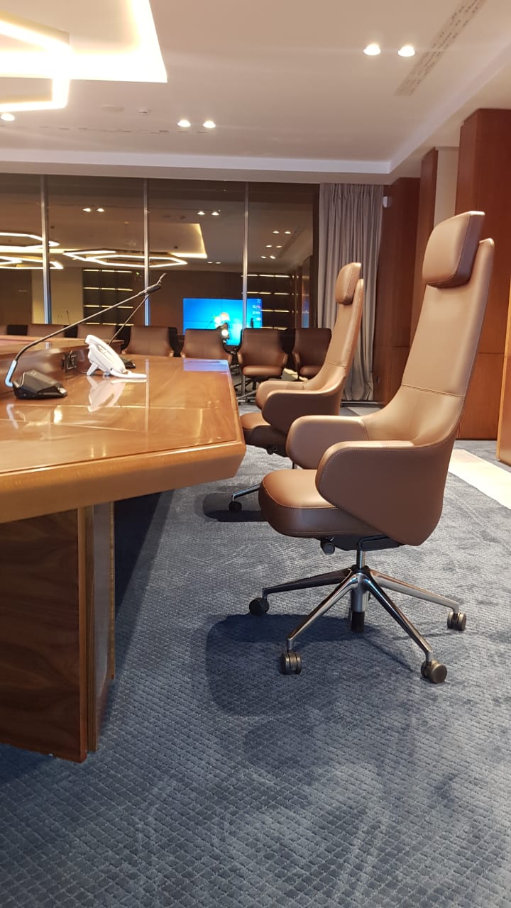 Close-up of Vitra's Grand Executive highback chairs in a corporate conference environment