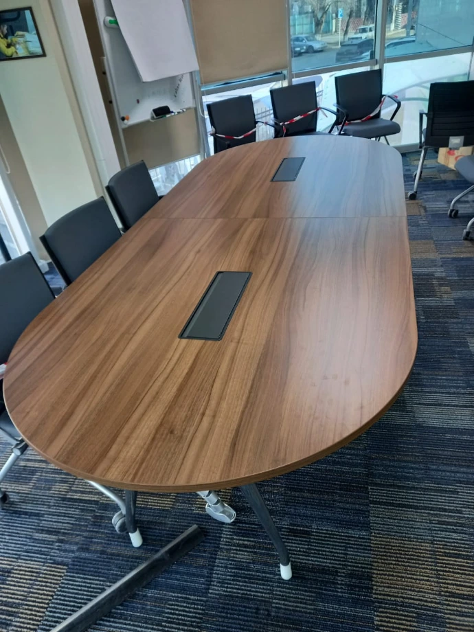 Grand Executive Desks with MillerKnoll Collective Chairs in a corporate conference room