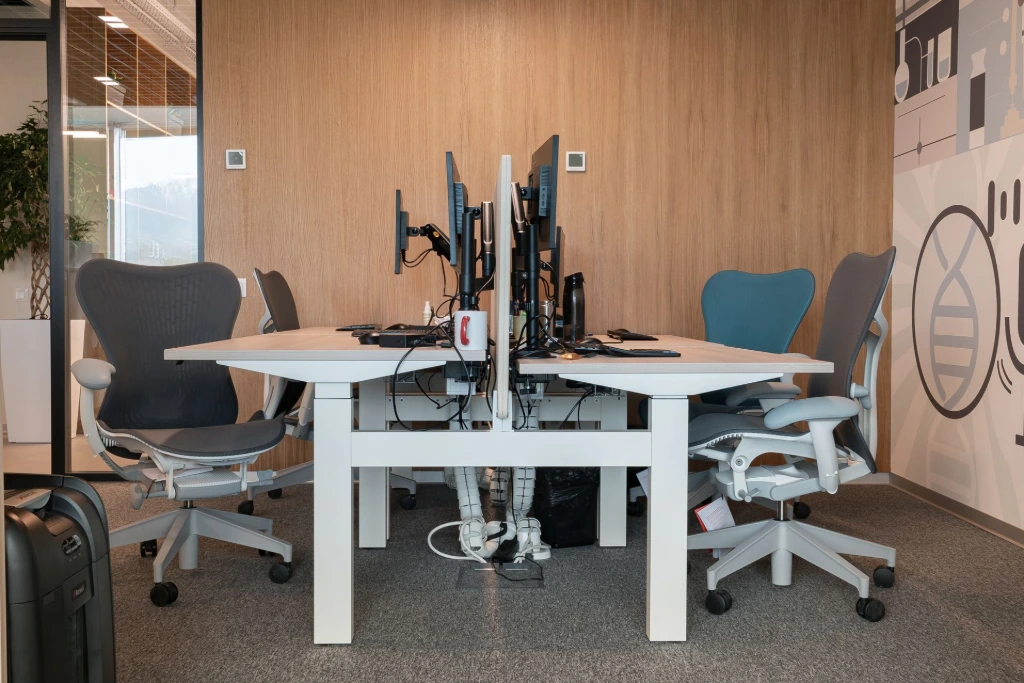 Herman Miller Mirra 2 hairs with Electirc Desks in a workstation