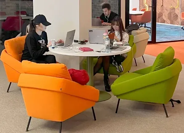 Meeting and collaboration space with a table and soft seating